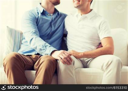 people, homosexuality, same-sex marriage, attraction and love concept - close up of happy male gay couple hugging at home