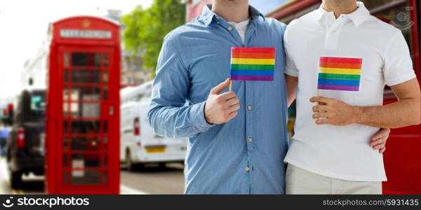 people, homosexuality, same-sex marriage, travel and love concept - close up of happy male gay couple hugging from back over london city street background