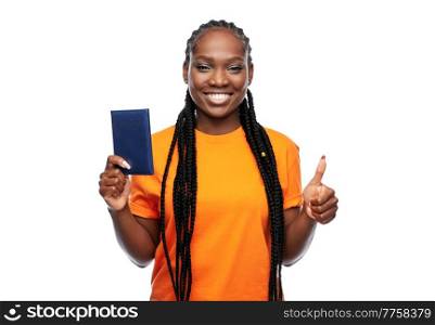 people, identity and citizenship concept - happy young woman with passport over white background. happy woman with passport over white background