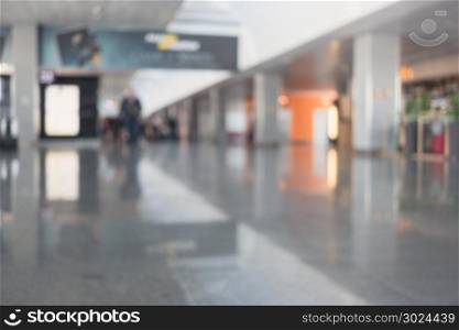 People in airport terminal. People in airport terminal, blurred abstract background.