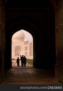 People in arch of Taj Mahal, Agra, India