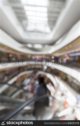 people in department store for use as shopping concept, blur background with bokeh light
