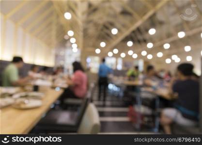 people in restaurant, blur background with bokeh light