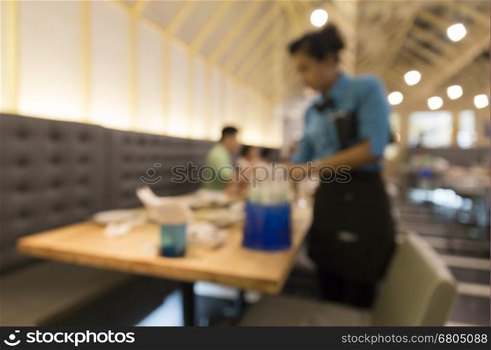 people in restaurant, blur background with bokeh light