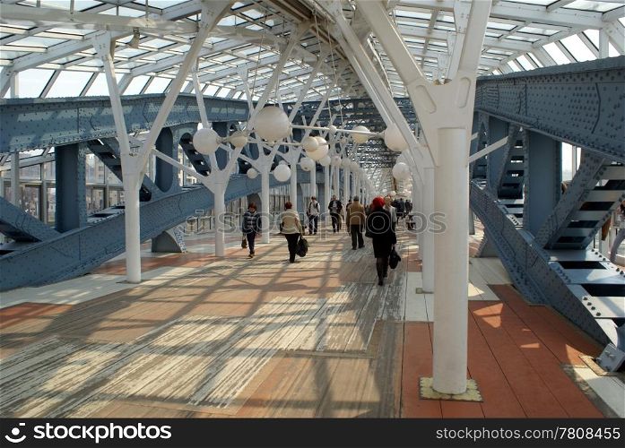 People inside iron bridge in Moscow, Russia