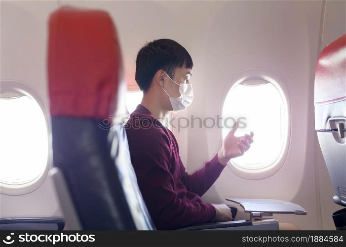 People is touching virtual screen in airplane , modern technology and transportation concept.