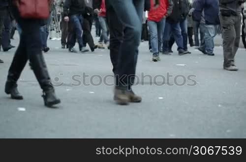 People legs walking in city