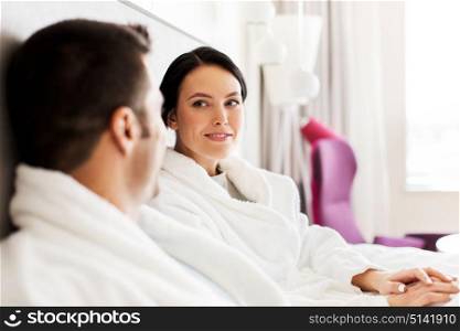 people, leisure and vacation concept - happy couple in bed at home or hotel room. happy couple in bed at home or hotel room