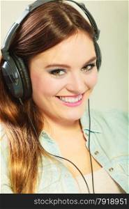 People leisure relax concept. Closeup happy woman big headphones listening music mp3 relaxing