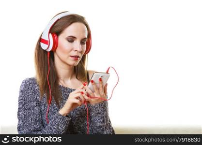 People leisure relax concept. Woman casual style red big headphones listening music mp3 relaxing