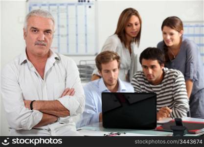 People looking at a computer