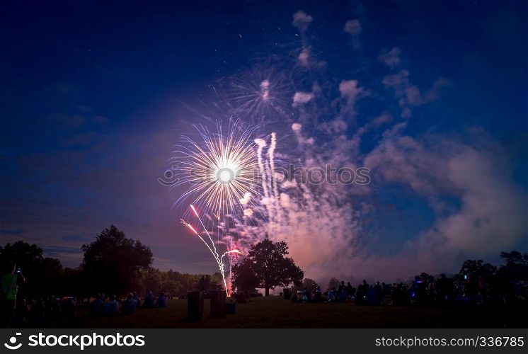 People looking at fireworks in honor of Independence Day. Fireworks on Independence day in USA