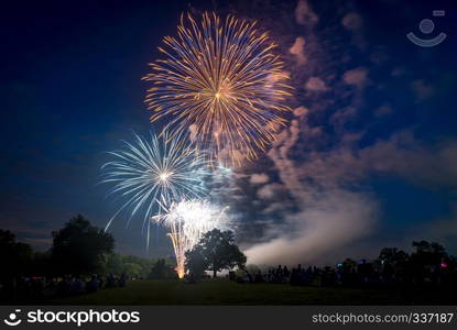 People looking at fireworks in honor of Independence Day. Fireworks on Independence day in USA