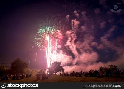 People looking at fireworks in honor of Independence Day. Fireworks on Independence day in USA