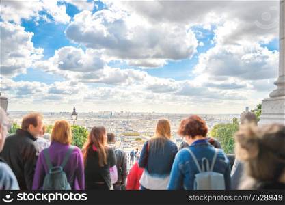 People looking to city of Paris from Montmartre