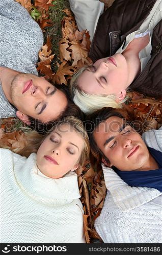 People lying in the leaves