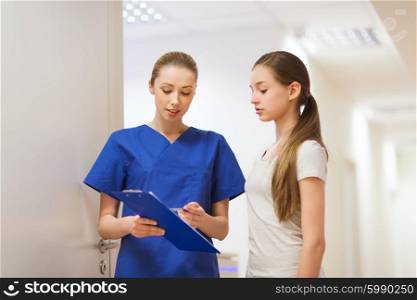 people, medicine and health care concept - doctor or nurse with clipboard and girl patient