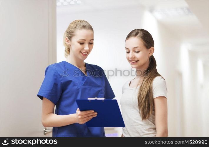 people, medicine and health care concept - happy doctor or nurse with clipboard and girl patient