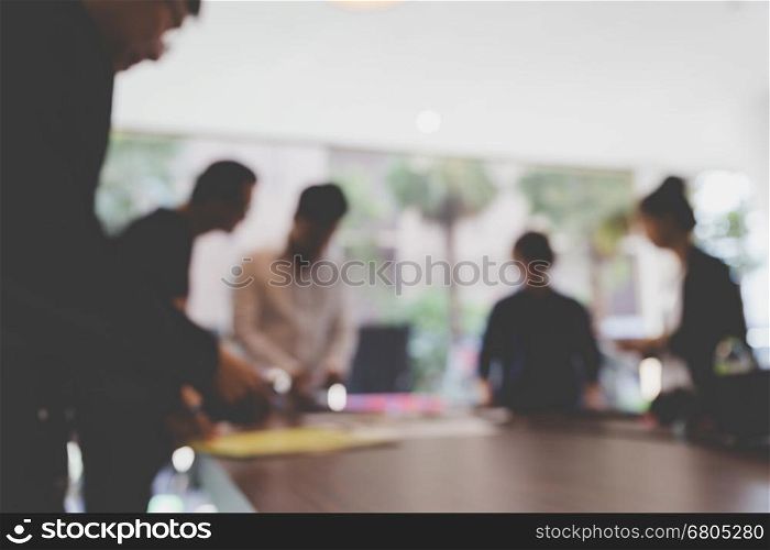 people meeting and working in office workplace - blur background