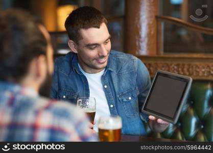 people, men, leisure, friendship and technology concept - happy male friends with tablet pc computer drinking beer at bar or pub