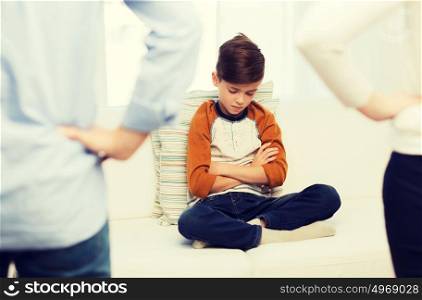 people, misbehavior, family and relations concept - close up of upset or feeling guilty boy and parents at home. upset or feeling guilty boy and parents at home