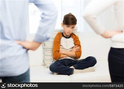 people, misbehavior, family and relations concept - close up of upset or feeling guilty boy and parents at home