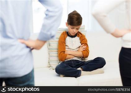 people, misbehavior, family and relations concept - close up of upset or feeling guilty boy and parents at home