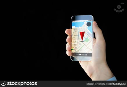 people, modern technology, application and navigation concept - close up of male hand holding and showing transparent smartphone with gps and road map on screen over black background