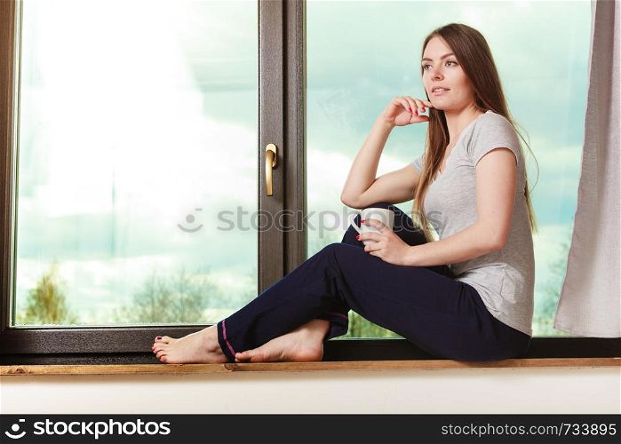 People mornings concept. Beautiful woman drinking morning coffee. Attractive young lady chilling out.. Beautiful woman drinking morning coffee.