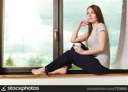 People mornings concept. Beautiful woman drinking morning coffee. Attractive young lady chilling out.. Beautiful woman drinking morning coffee.