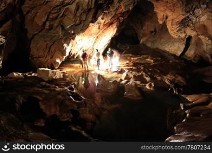 People near underground lake in cave, Sagada