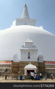 People near white stupa Ruwanwelisaya Ched in Anuradhapura, Sri Lanka