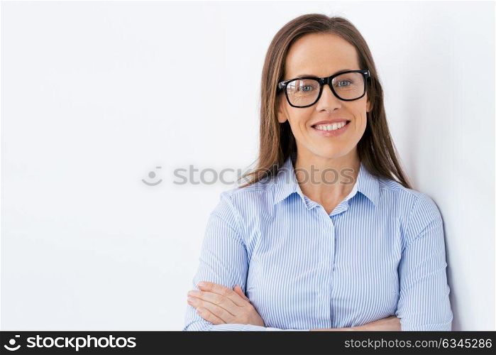 people, office and vision concept - close up of happy smiling middle aged businesswoman in glasses. close up of smiling middle aged woman in glasses