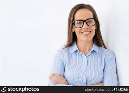 people, office and vision concept - close up of happy smiling middle aged businesswoman in glasses. close up of smiling middle aged woman in glasses