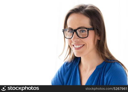 people, office and vision concept - close up of happy smiling middle aged woman in glasses. close up of smiling middle aged woman in glasses