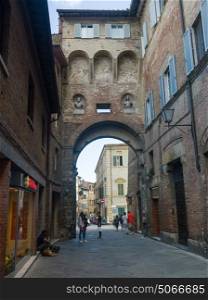 People on street amidst buildings, Siena, Tuscany, Italy