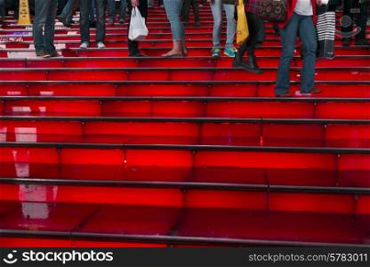 People on the illuminated steps at Time Square, Manhattan, New York City, New York State, USA