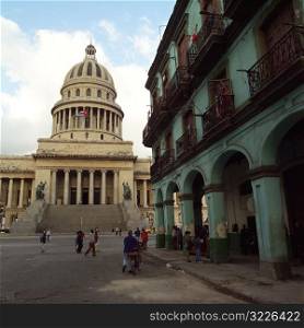 People on the street in front of the capitol building, Havana, Cuba