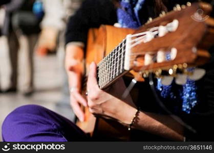 People playing guitar in street