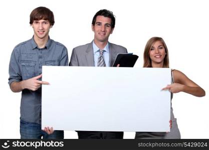 People pointing at blank board