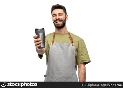 people, profession and job concept - happy smiling waiter in apron holding tumbler or takeaway thermo cup over white background. happy waiter with tumbler or takeaway thermo cup
