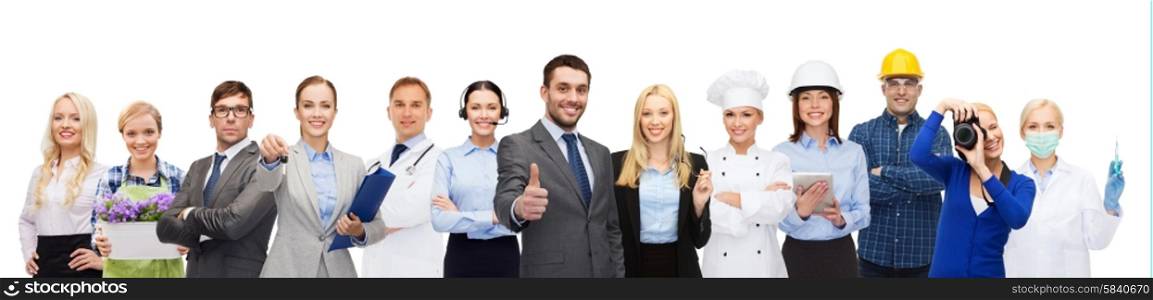people, profession, qualification, employment and success concept - happy businessman over professional workers showing thumbs up