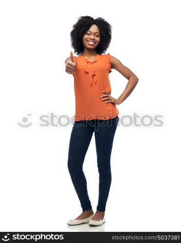 people, race, ethnicity and gesture concept - happy african american young woman showing thumbs up over white. happy african american woman showing thumbs up