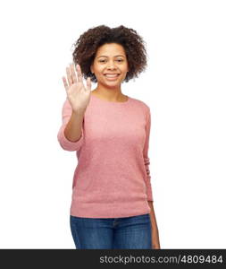 people, race, ethnicity and gesture concept - happy african american young woman waving hand over white