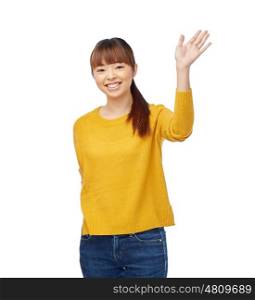 people, race, ethnicity and gesture concept - happy smiling asian young woman waving hand over white