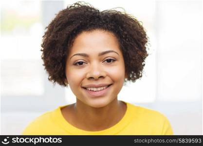 people, race, ethnicity and portrait concept - happy african american young woman face