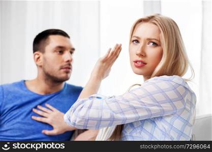 people, relationship difficulties, conflict and family concept - unhappy couple arguing at home. unhappy couple having argument at home