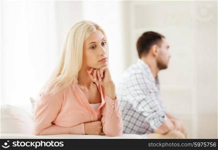 people, relationship difficulties, conflict and family concept - unhappy couple having argument at home