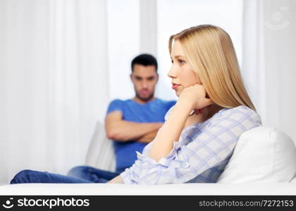 people, relationship difficulties, conflict and family concept - unhappy couple having argument at home. unhappy couple having argument at home