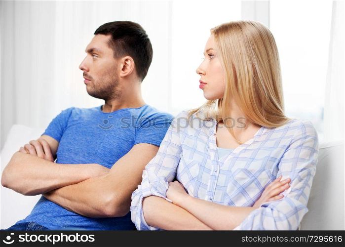 people, relationship difficulties, conflict and family concept - unhappy couple having argument at home. unhappy couple having argument at home